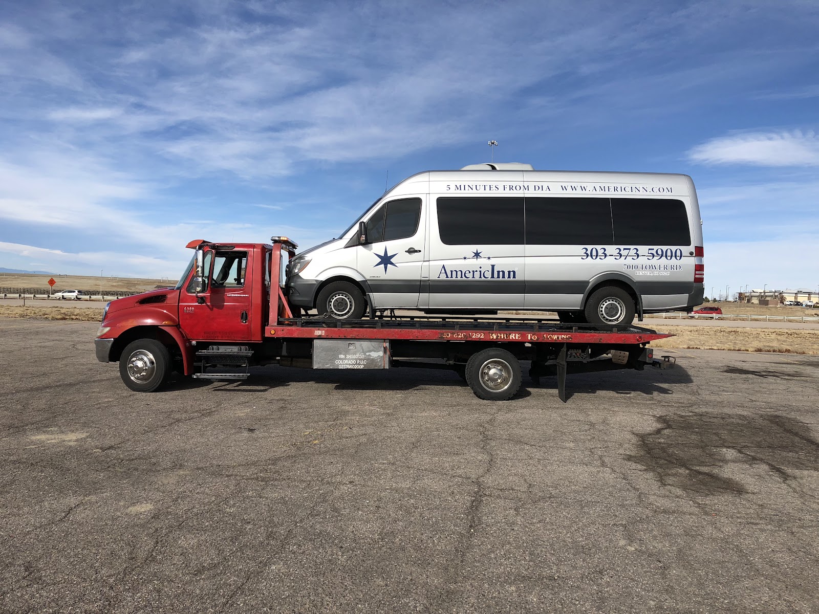 Denver Where to Towing flatbed carrying a shuttle van in Colorado